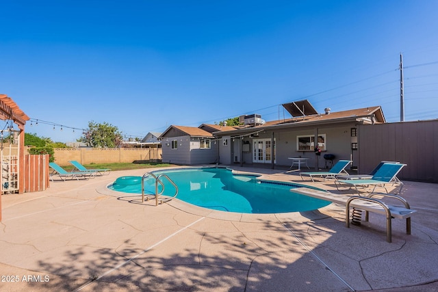 3408 W Carol Ave, Phoenix, AZ 85051 - view of pool with french doors, a fenced in pool, a patio, and fence