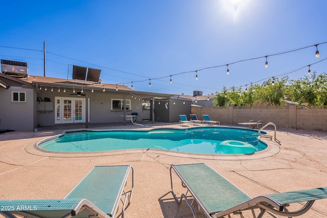 3408 W Carol Ave, Phoenix, AZ 85051 - view of swimming pool with a fenced in pool, a fenced backyard, a patio area, and french doors