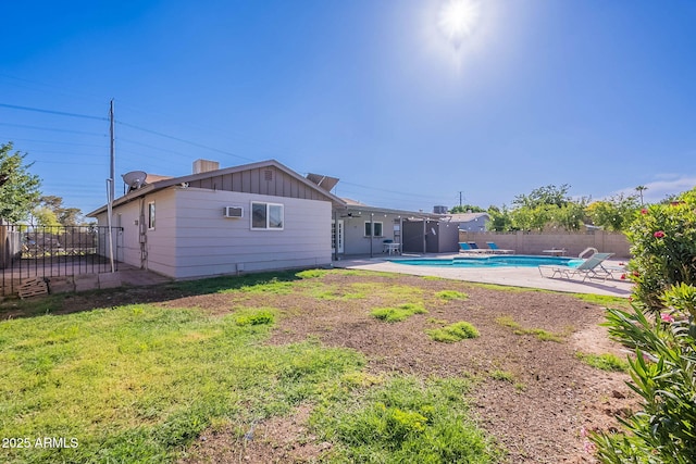 3408 W Carol Ave, Phoenix, AZ 85051 - back of house featuring a patio, a fenced backyard, board and batten siding, and a fenced in pool