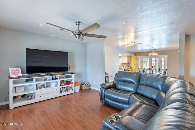 3408 W Carol Ave, Phoenix, AZ 85051 - living area with ceiling fan, french doors, baseboards, wood finished floors, and visible vents