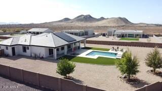 2517 W Canyon Rd, Phoenix, AZ 85086 - view of subject property featuring a pool and a mountain backdrop