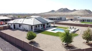 2517 W Canyon Rd, Phoenix, AZ 85086 - view of subject property with a pool area and a mountain backdrop