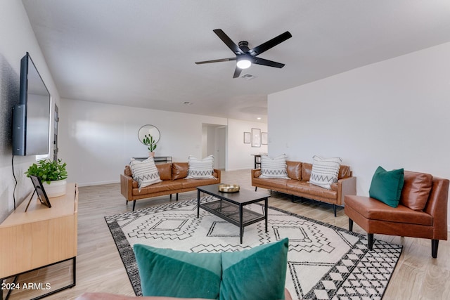 living room with ceiling fan and hardwood / wood-style floors