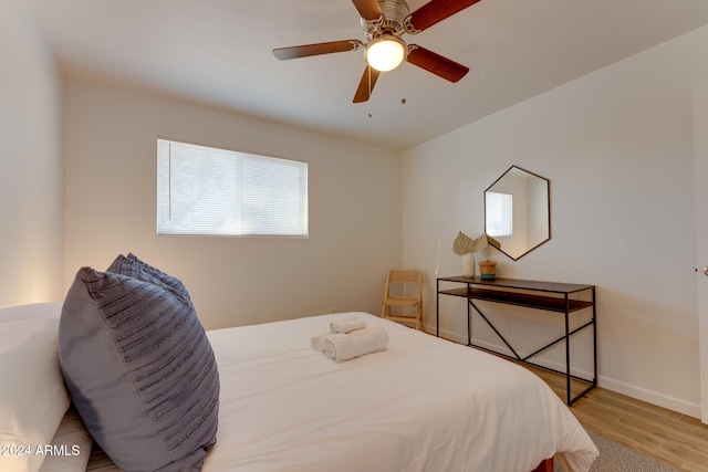 bedroom featuring ceiling fan and light wood-type flooring