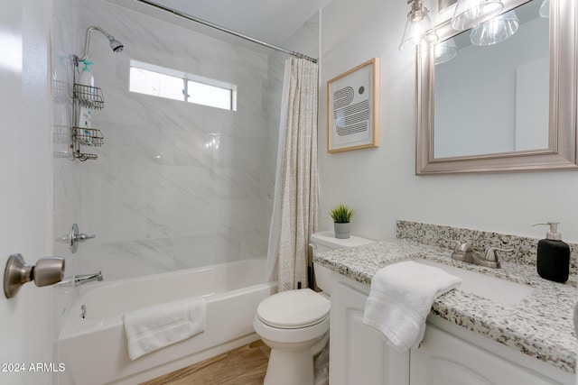 full bathroom featuring vanity, toilet, and shower / bath combo with shower curtain