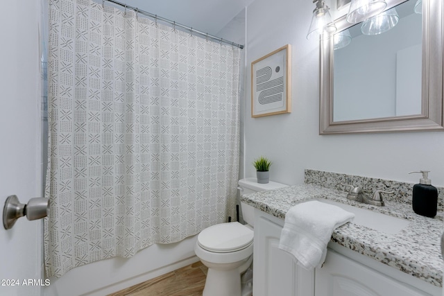 full bathroom with shower / bath combination with curtain, vanity, and toilet