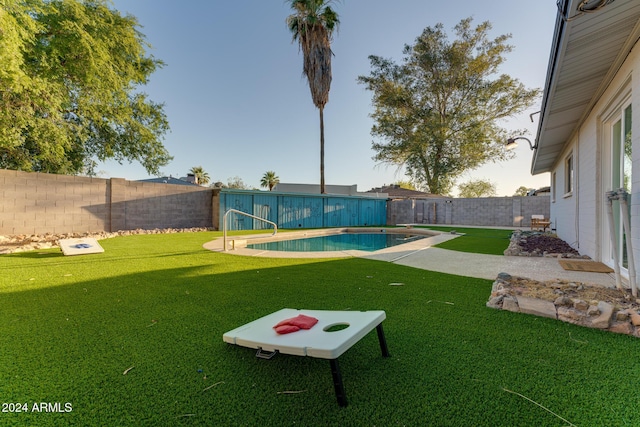 view of yard with a fenced in pool