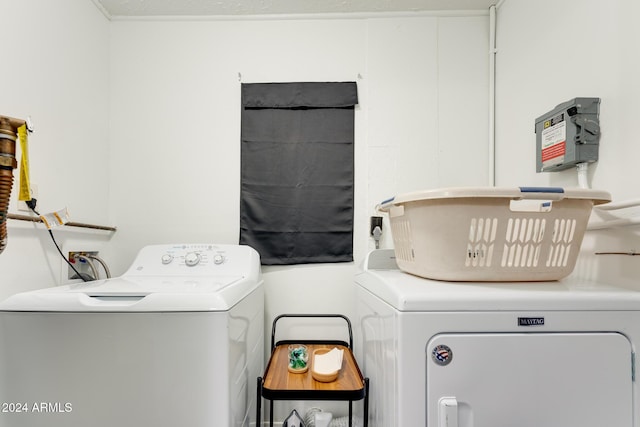 clothes washing area with separate washer and dryer