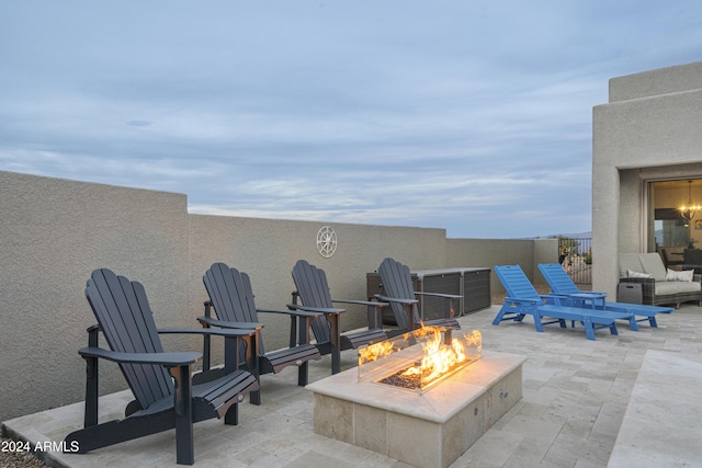 view of patio / terrace featuring an outdoor fire pit