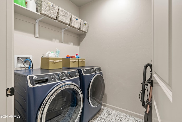 laundry area with washing machine and clothes dryer