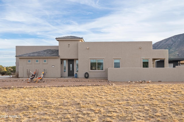 back of property with a mountain view