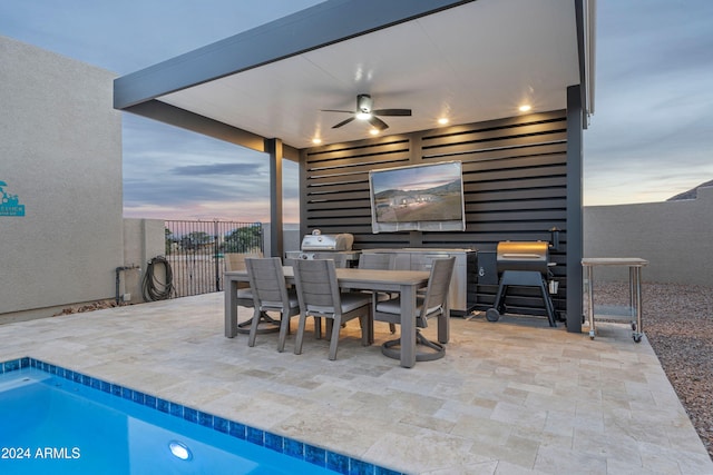 view of patio with a fenced in pool and ceiling fan