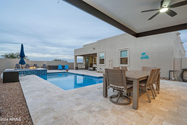 view of pool with ceiling fan and a patio area