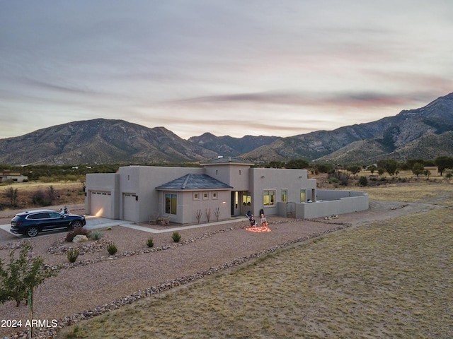 view of front of house featuring a mountain view and a garage