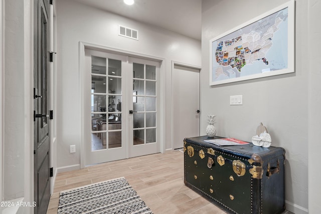 interior space featuring french doors and light hardwood / wood-style flooring