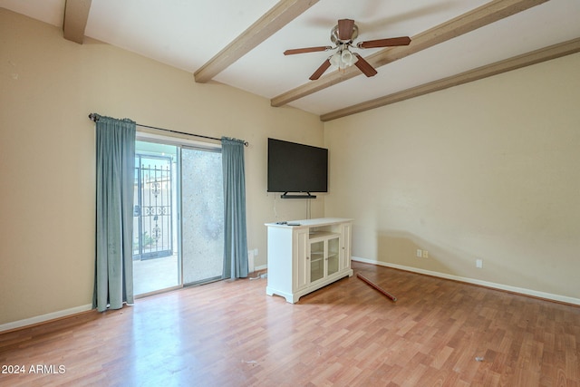 unfurnished living room featuring beam ceiling, ceiling fan, and wood-type flooring