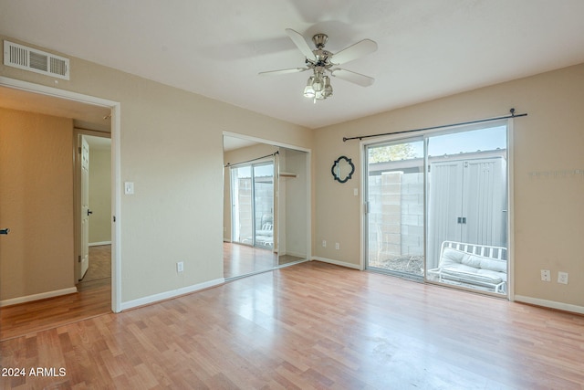 spare room featuring light hardwood / wood-style flooring and ceiling fan