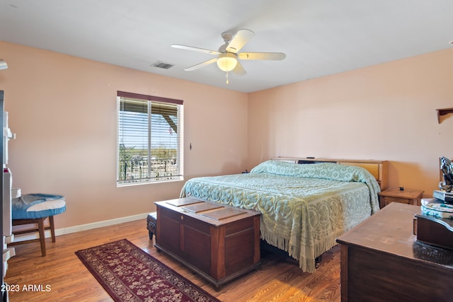 bedroom featuring ceiling fan and light hardwood / wood-style flooring