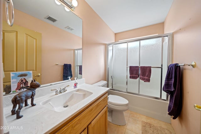 full bathroom featuring tile floors, combined bath / shower with glass door, toilet, and vanity