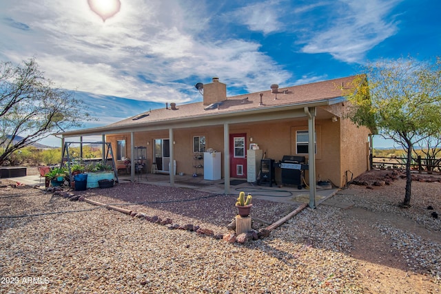 back of house featuring a patio