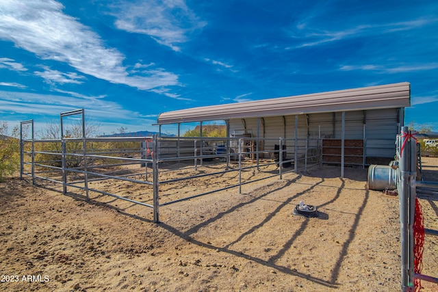 view of horse barn featuring an outdoor structure