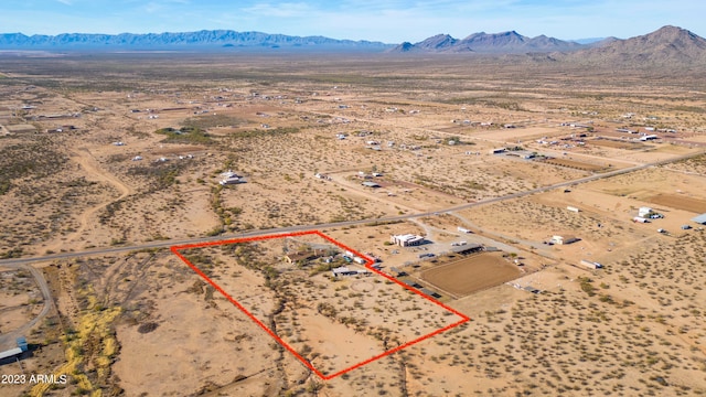 birds eye view of property featuring a mountain view