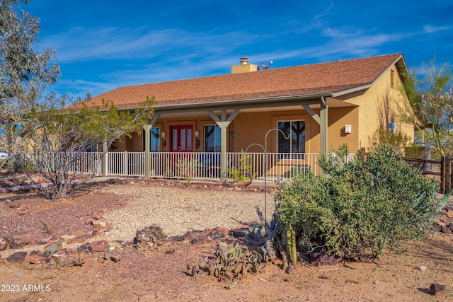 view of front of property featuring covered porch