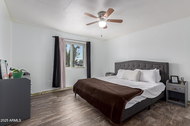 bedroom featuring a ceiling fan and wood finished floors