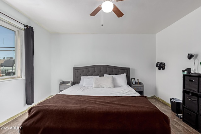 bedroom featuring ceiling fan and wood finished floors