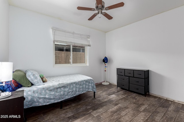 bedroom with a ceiling fan and wood finished floors