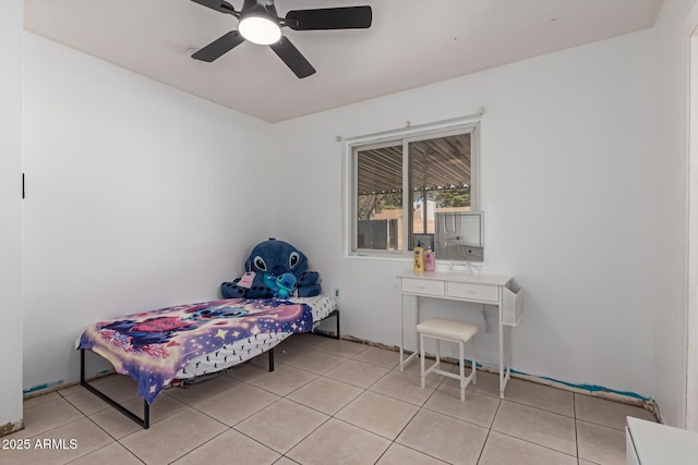 bedroom featuring light tile patterned floors and a ceiling fan