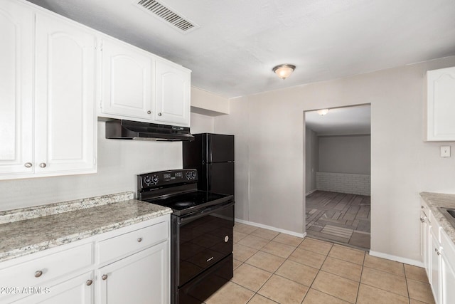 kitchen with light tile patterned flooring, white cabinets, and black appliances