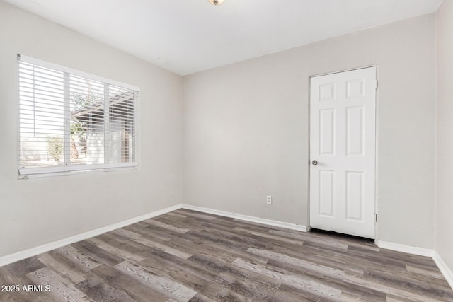 unfurnished room featuring wood-type flooring