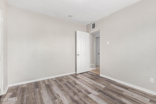 empty room featuring hardwood / wood-style floors