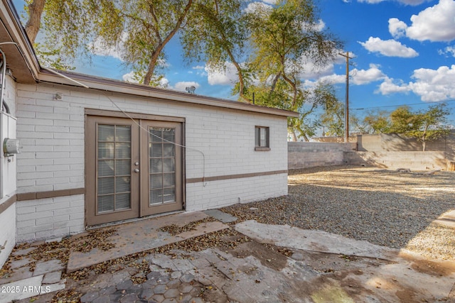 view of exterior entry featuring french doors