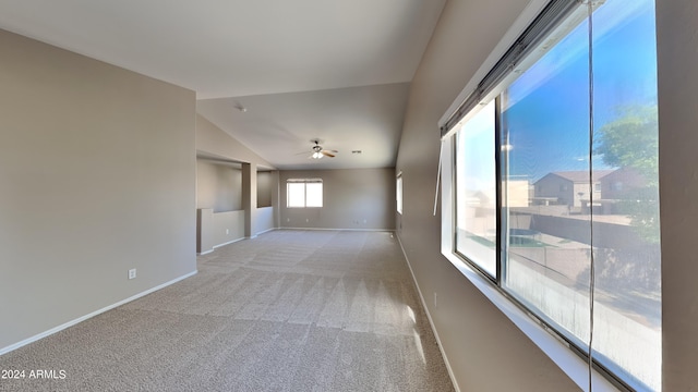 carpeted empty room with lofted ceiling and ceiling fan