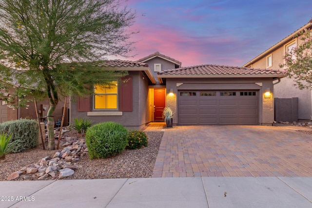4152 W Bradshaw Creek Ln, New River, AZ 85087 - view of front of property featuring an attached garage, stucco siding, driveway, and a tile roof
