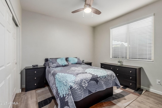 4152 W Bradshaw Creek Ln, New River, AZ 85087 - bedroom featuring light wood-style floors, a closet, and ceiling fan