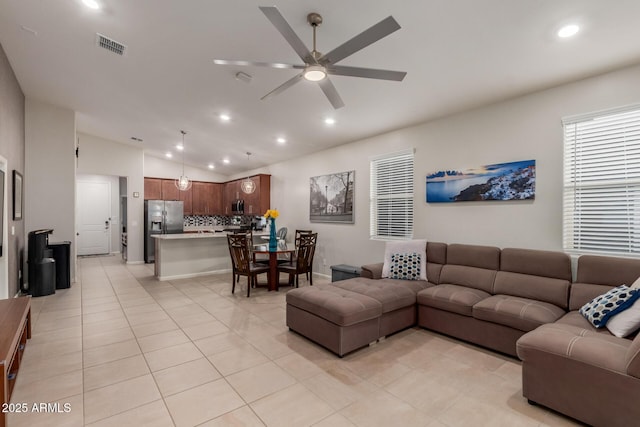 4152 W Bradshaw Creek Ln, New River, AZ 85087 - living area with vaulted ceiling, light tile patterned flooring, a ceiling fan, and recessed lighting