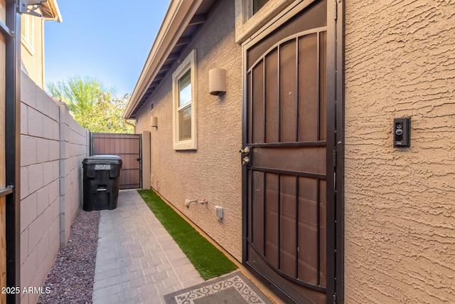 4152 W Bradshaw Creek Ln, New River, AZ 85087 - property entrance featuring a gate and stucco siding