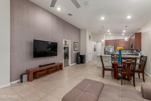 4152 W Bradshaw Creek Ln, New River, AZ 85087 - living area featuring lofted ceiling, ceiling fan, recessed lighting, light tile patterned floors, and an accent wall