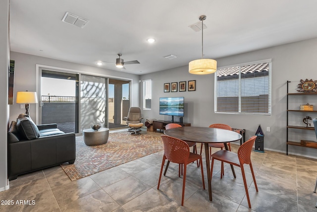 dining space with ceiling fan