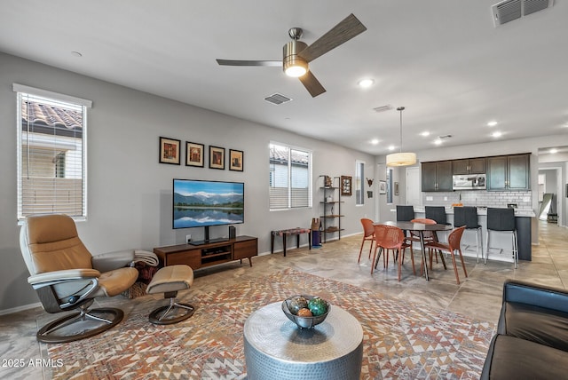 living room featuring ceiling fan