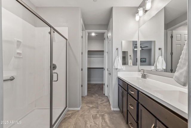 bathroom featuring vanity and a shower with door