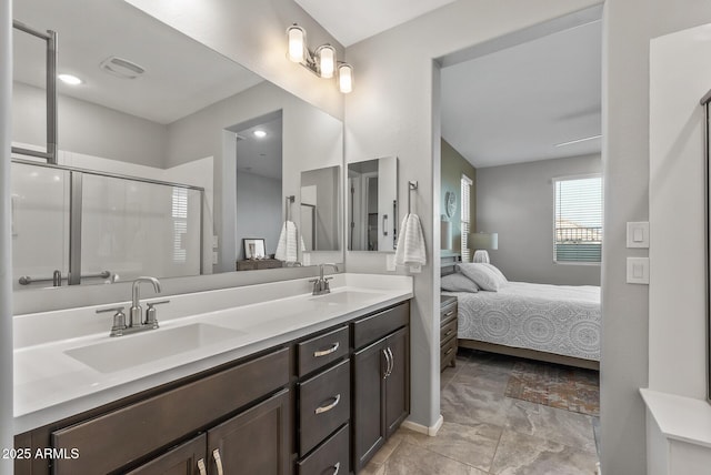 bathroom with walk in shower and vanity