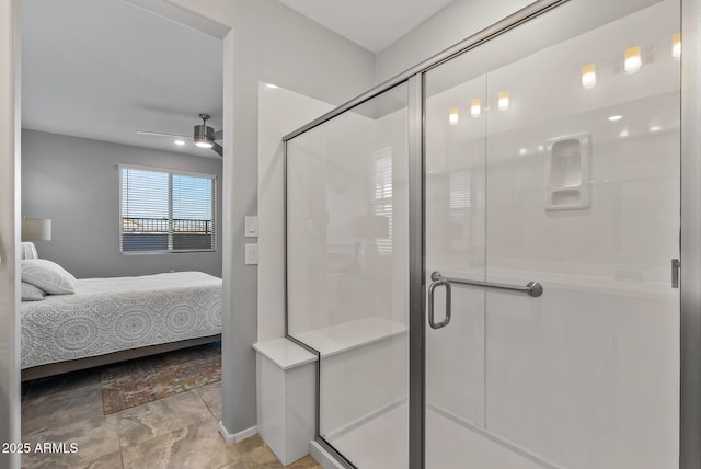 bathroom with a shower with shower door and ceiling fan