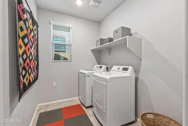 clothes washing area with separate washer and dryer