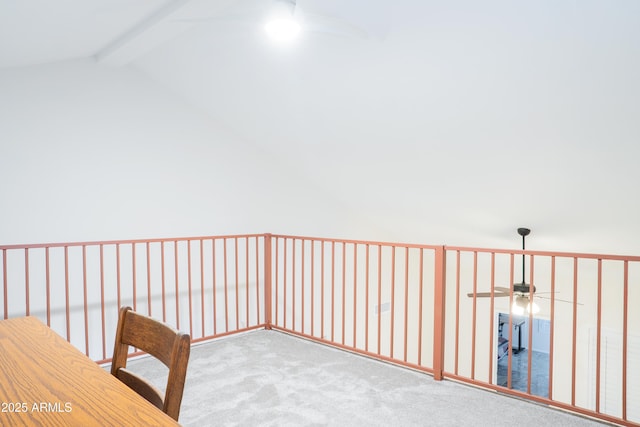 hall with carpet flooring and lofted ceiling with beams