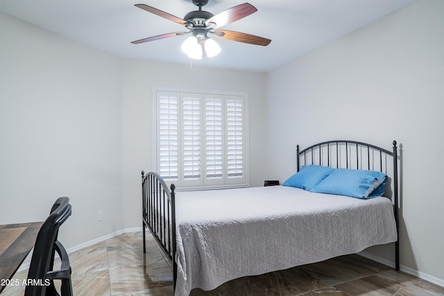 bedroom featuring baseboards and a ceiling fan