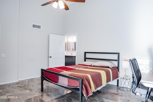 bedroom featuring a high ceiling, visible vents, ceiling fan, and marble finish floor